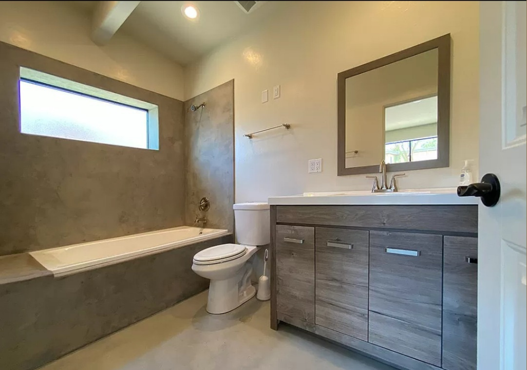 bathroom remodel, concrete flooring, concrete shower