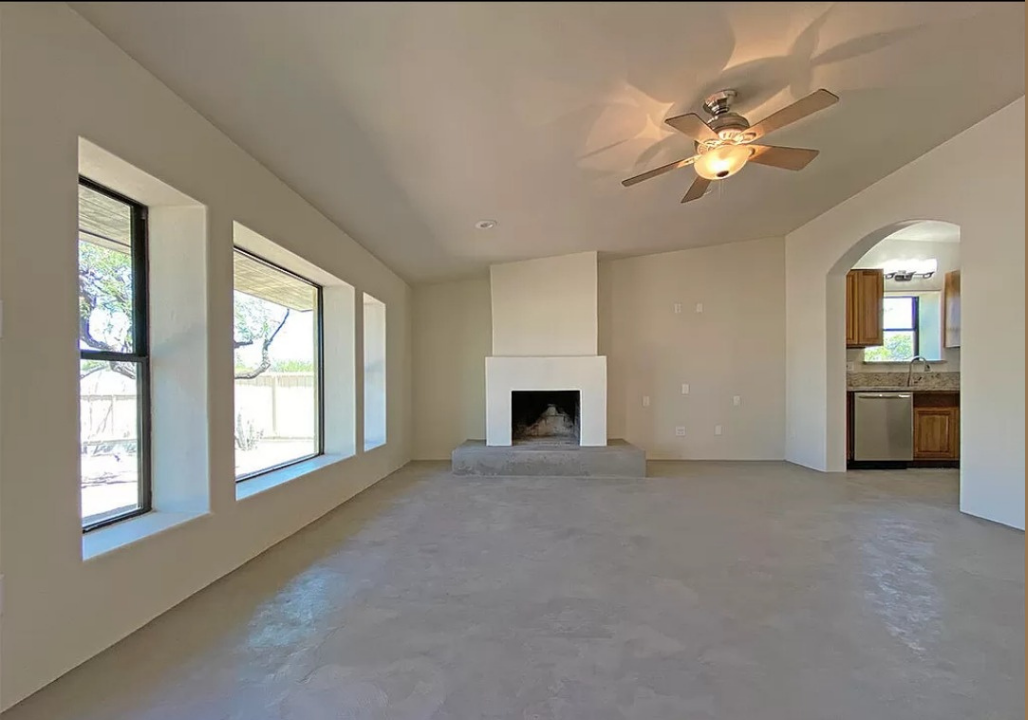concrete flooring, living room remodel, concrete fireplace