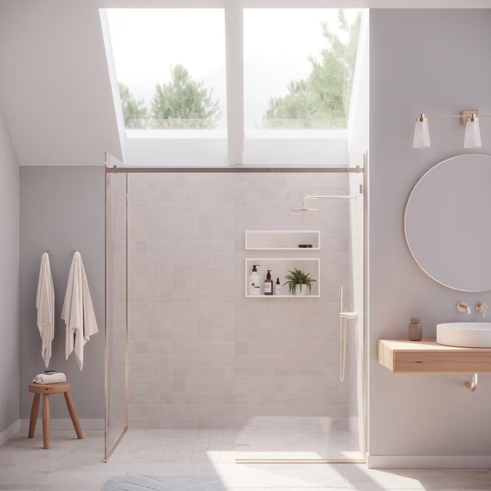 A bathroom with a walk in shower , sink , mirror and skylight.