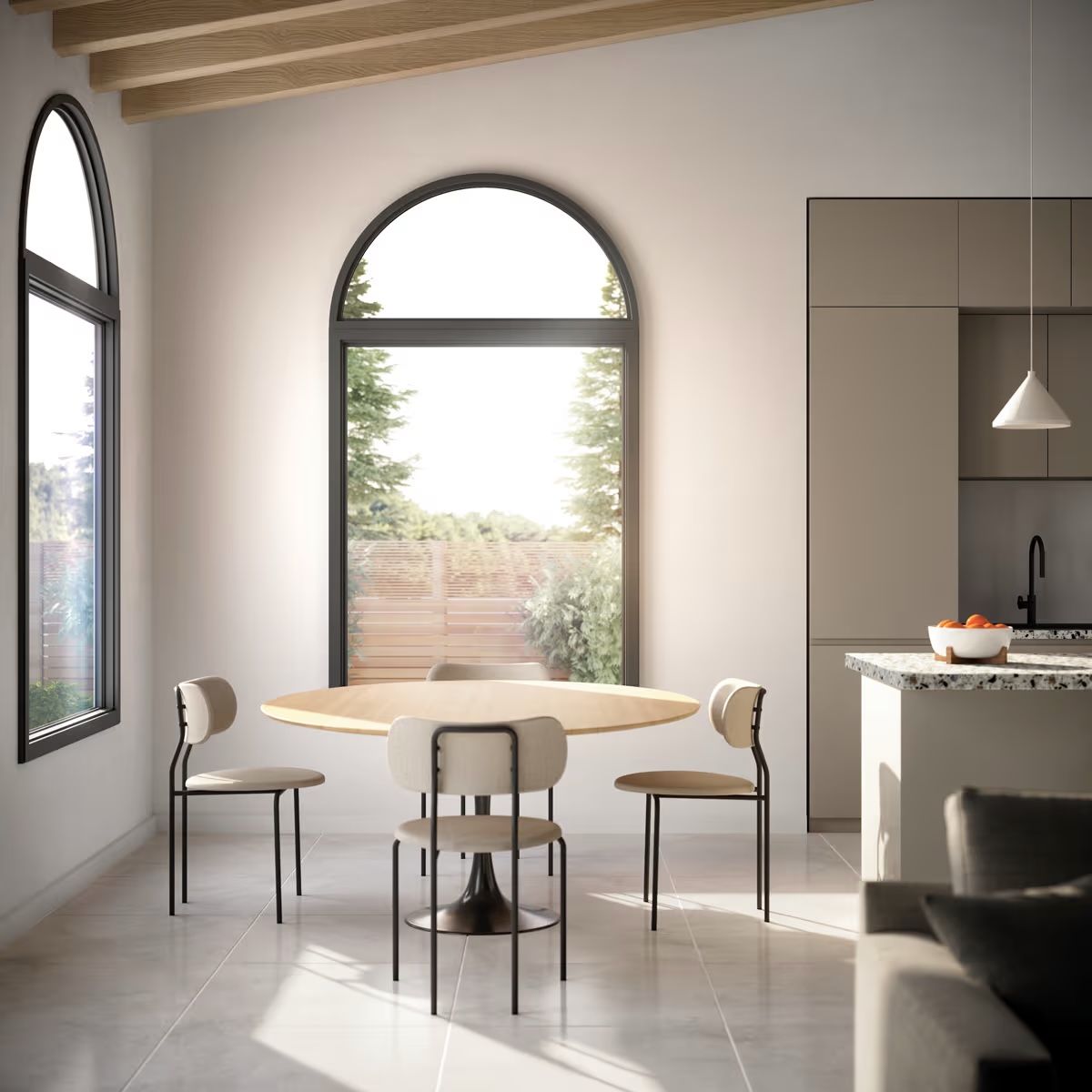 A dining room with a round table and chairs in front of a large window