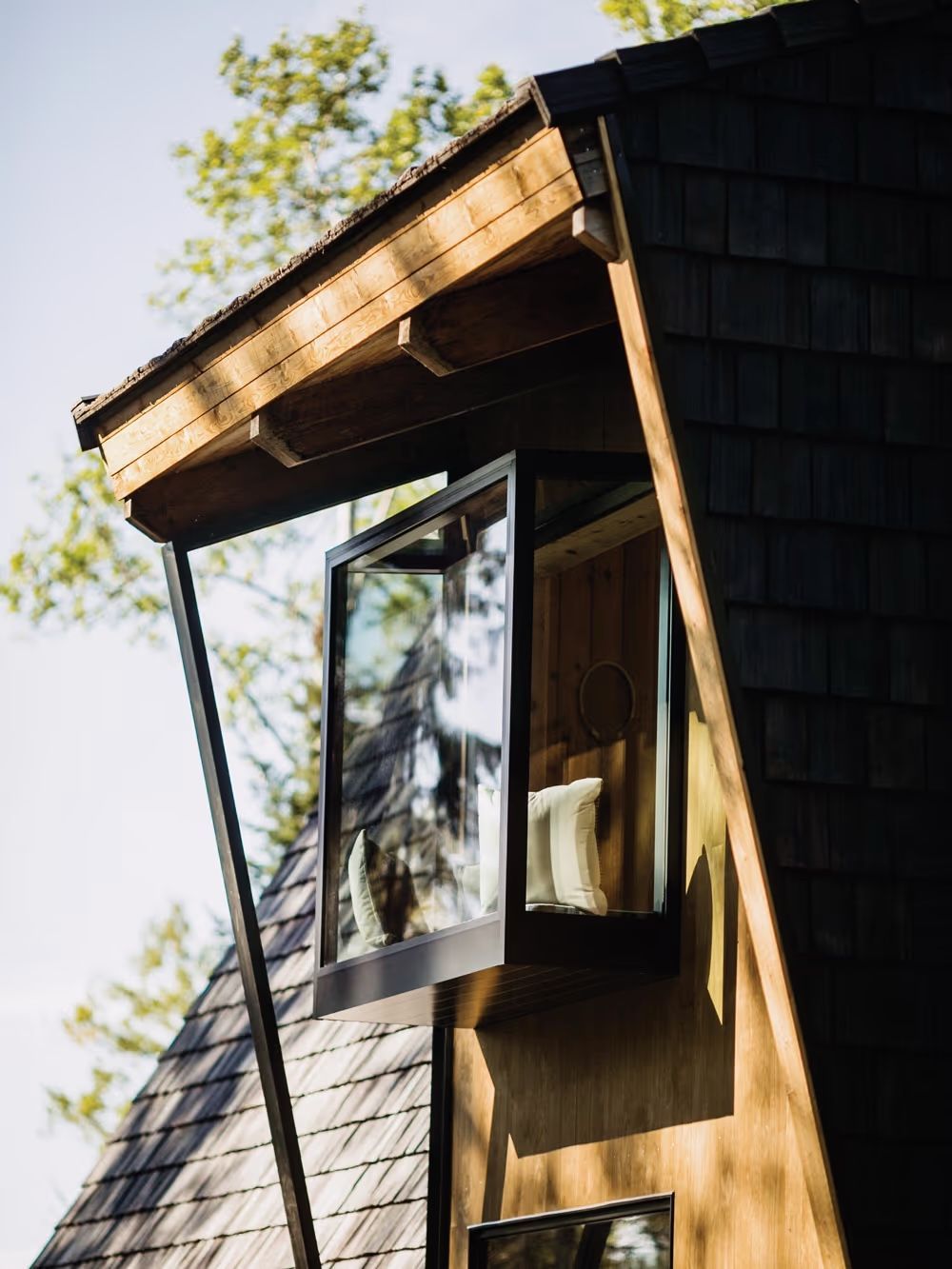 A house with a large window on the side of it
