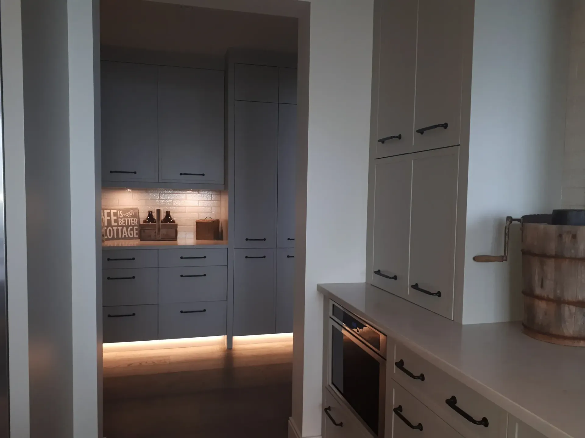 A kitchen with a sign on the wall that says