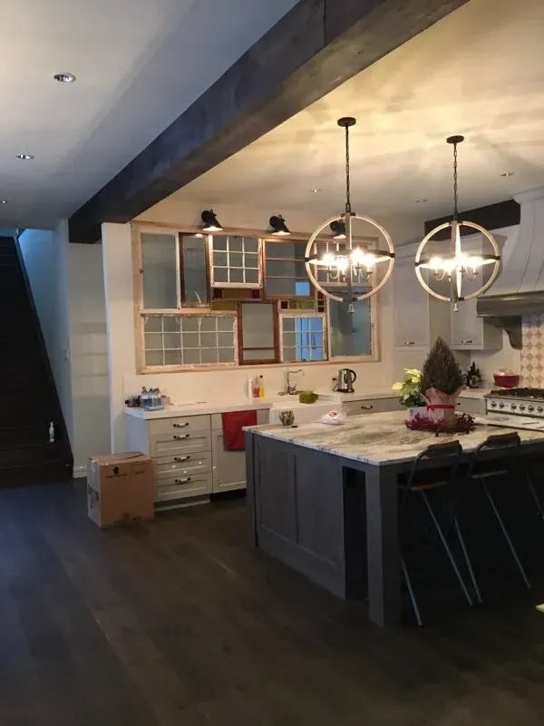 A kitchen with a large island and a stove.