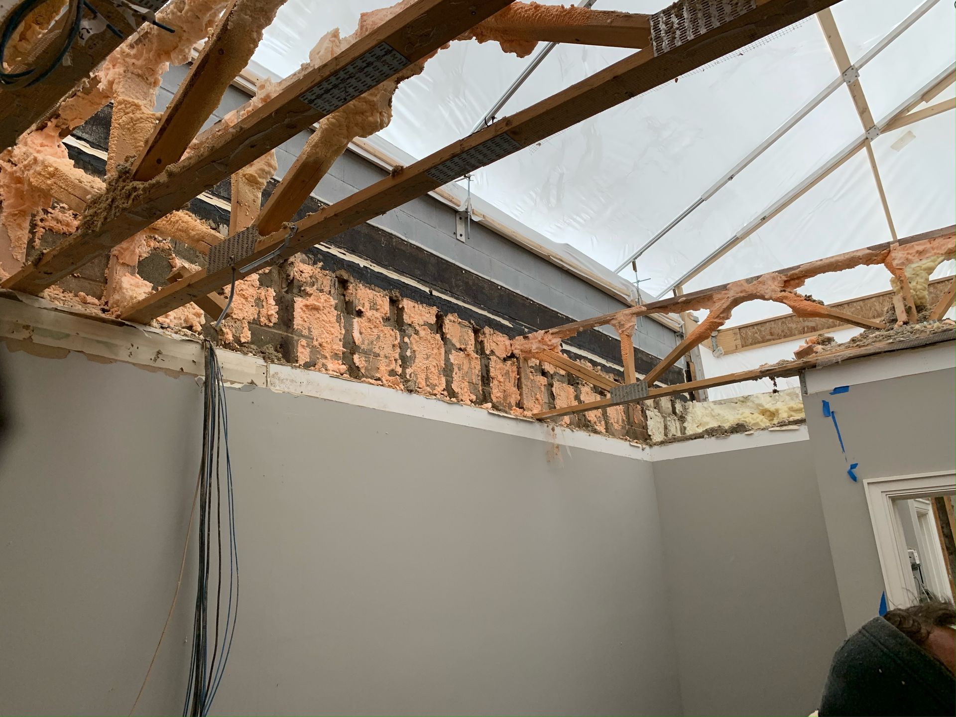 Only shrinkwrap between an entire house and the sky. 365 Construction Tent keeps Lakeview home dry during truss replacement