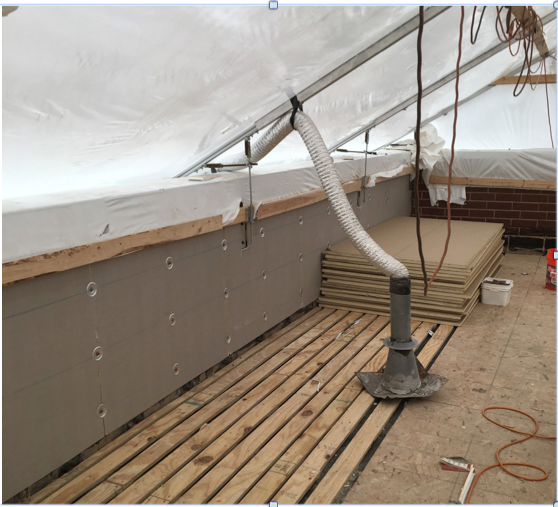 365 Construction Tents, standard tent and stack pipe venting system with WickRight Roof Vent installed on parapet wall