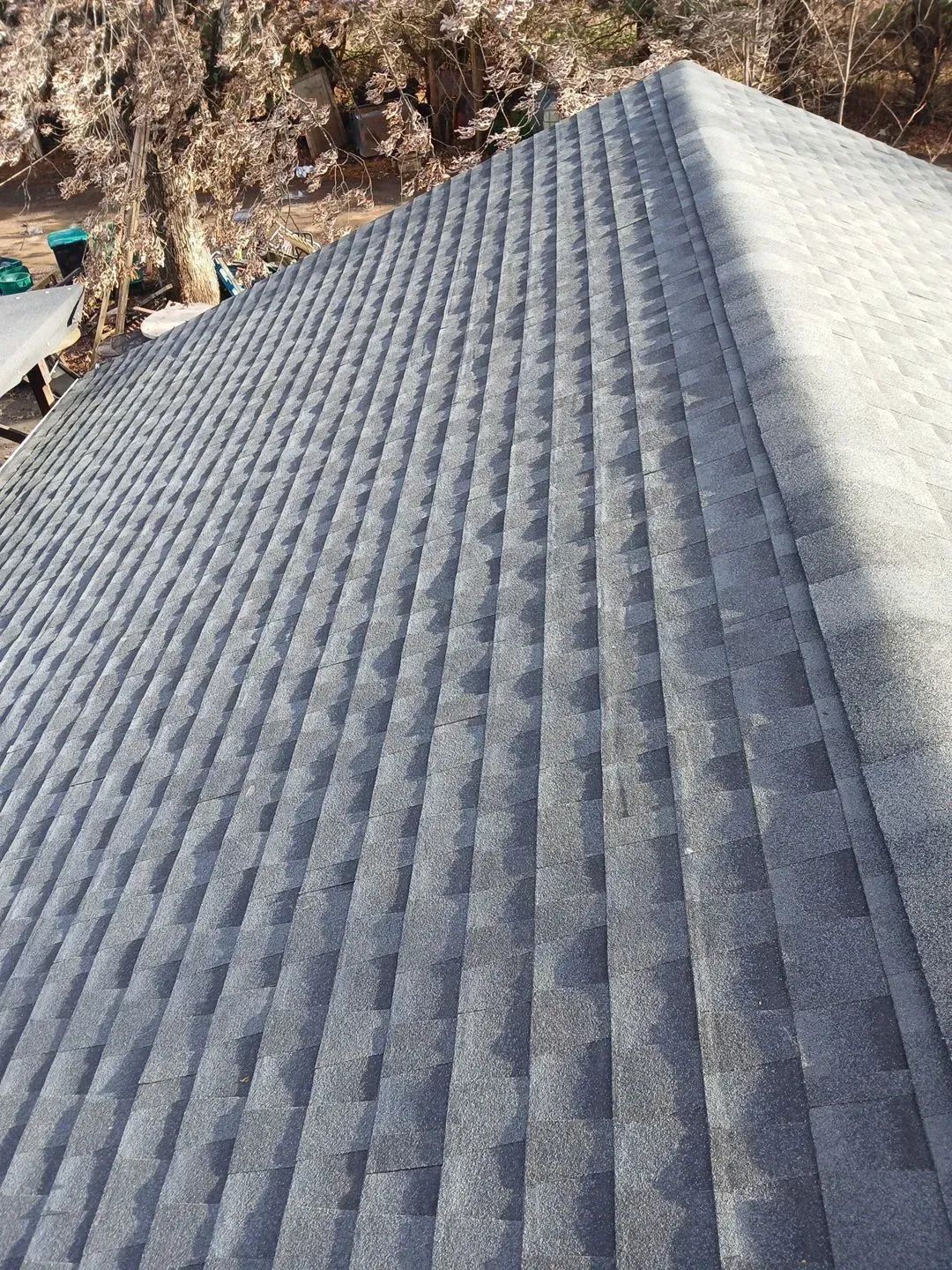 Gray asphalt shingle roof, angled view.