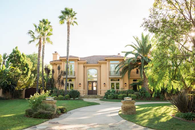 Luxury home surrounded by palm trees in Ventura County