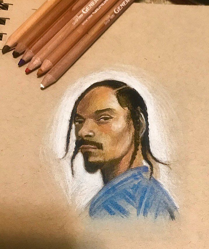 A drawing of snoop dogg next to colored pencils