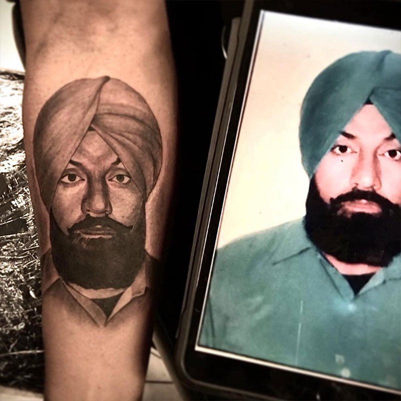 A tattoo of a man with a turban and a beard