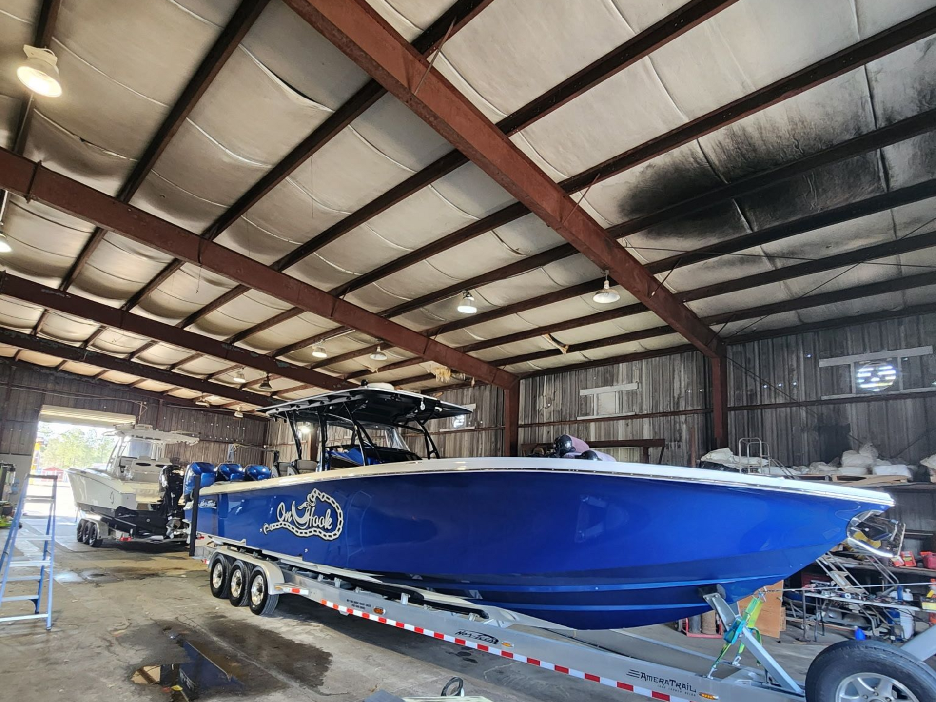 A Dark-colored Bass Boat on a Trailer Parked — Valentine Detailing LLC in Walterboro, SC