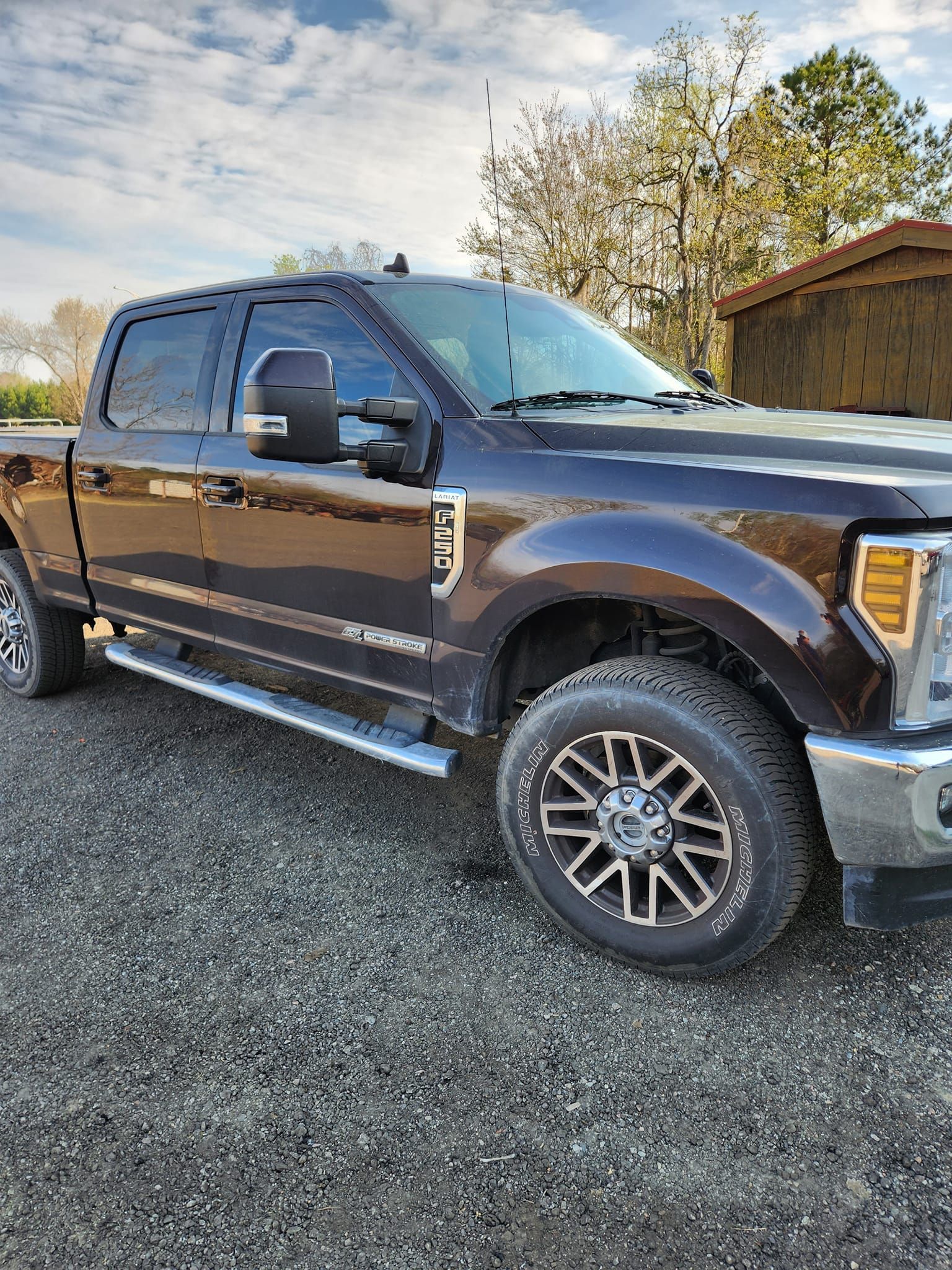 A Dark-colored Ford Super Duty Crew Cab Pickup Truck Parked on a Gravel — Valentine Detailing LLC in Walterboro, SC