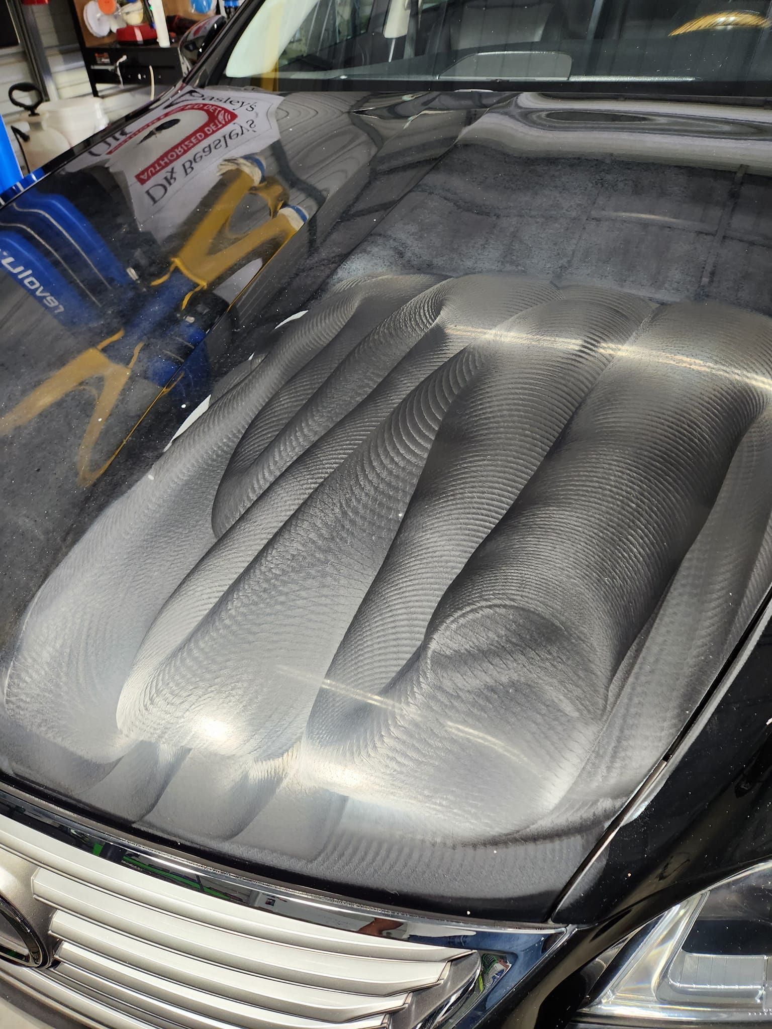A Close-up View of a Car Hood Being Paint Corrected — Valentine Detailing LLC in Walterboro, SC