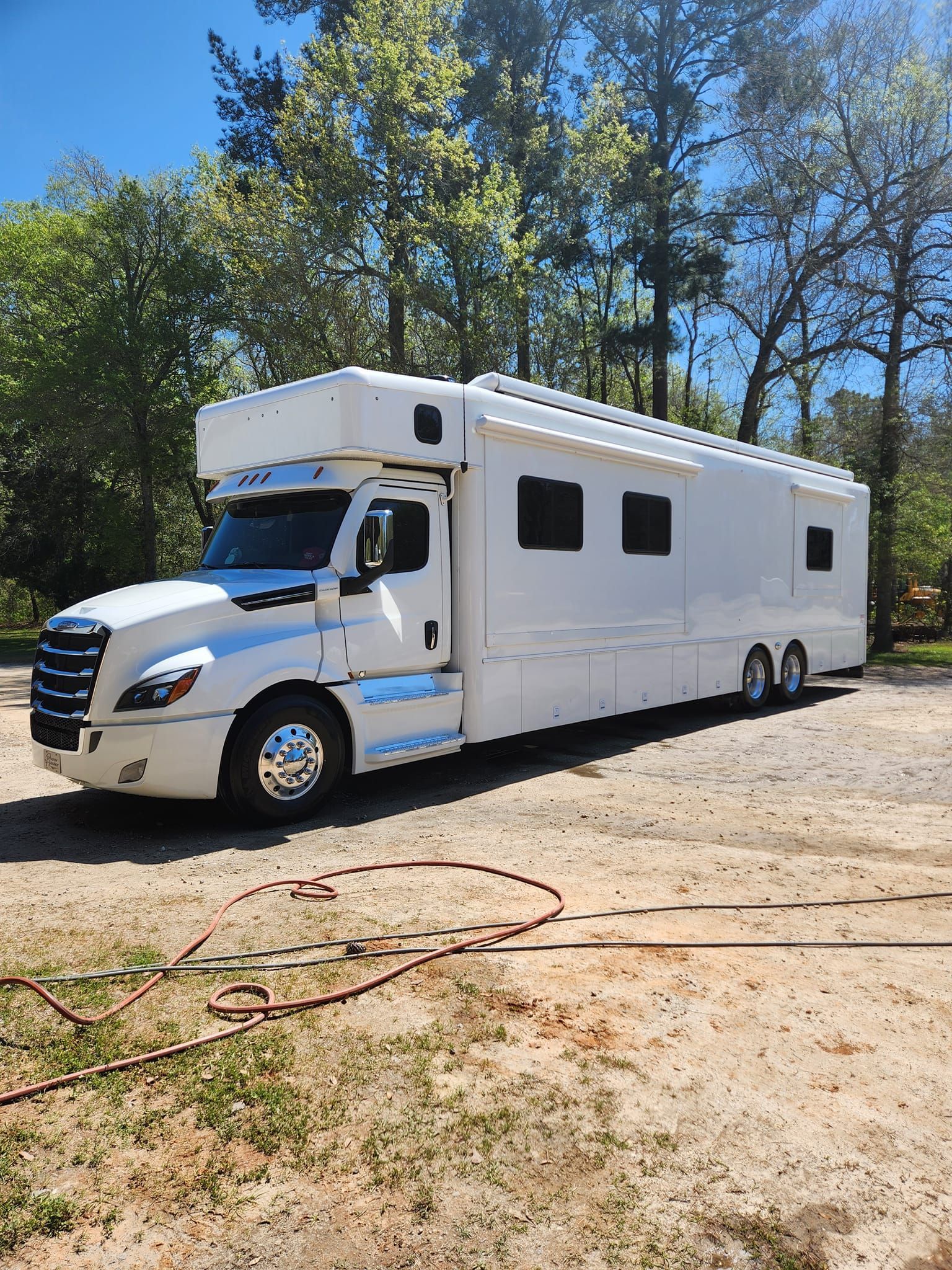 A White Custom Commercial Truck Parked on a Gravel Lot — Valentine Detailing LLC in Walterboro, SC