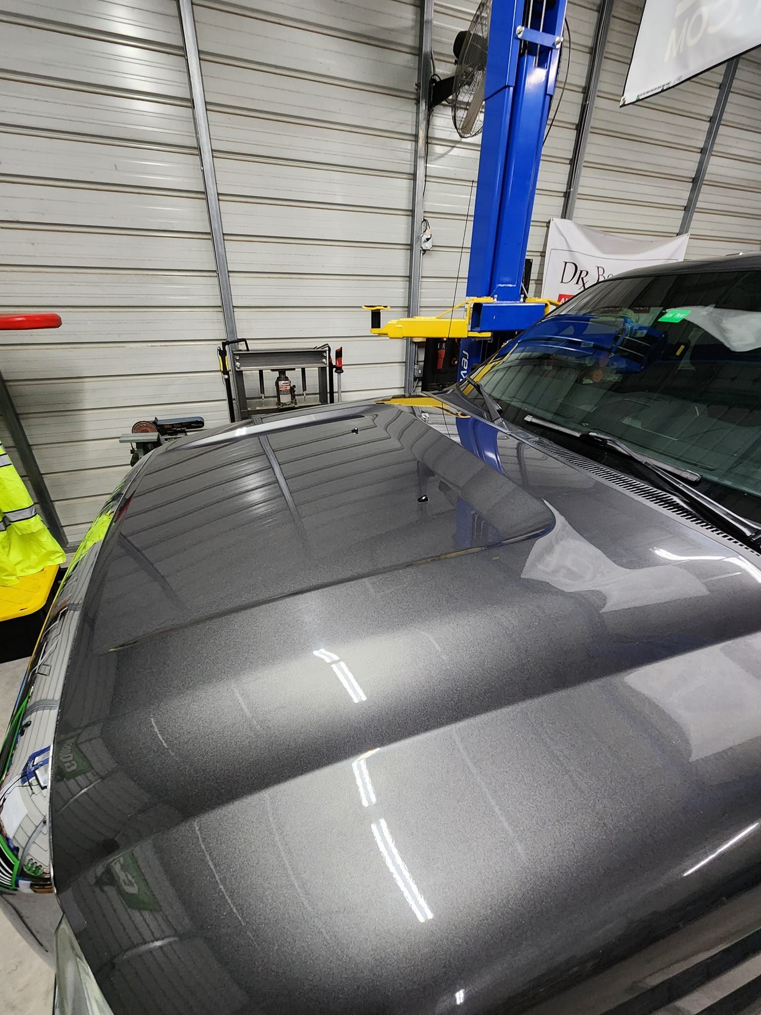 The Shiny Grey Hood of a Truck Parked in an Auto Repair Shop — Valentine Detailing LLC in Walterboro, SC