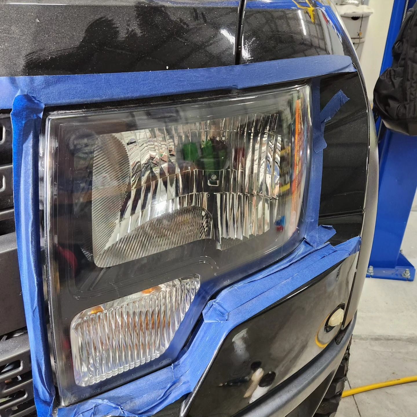 A Vehicle Headlight Masked With Blue Painter's Tape — Valentine Detailing LLC in Walterboro, SC