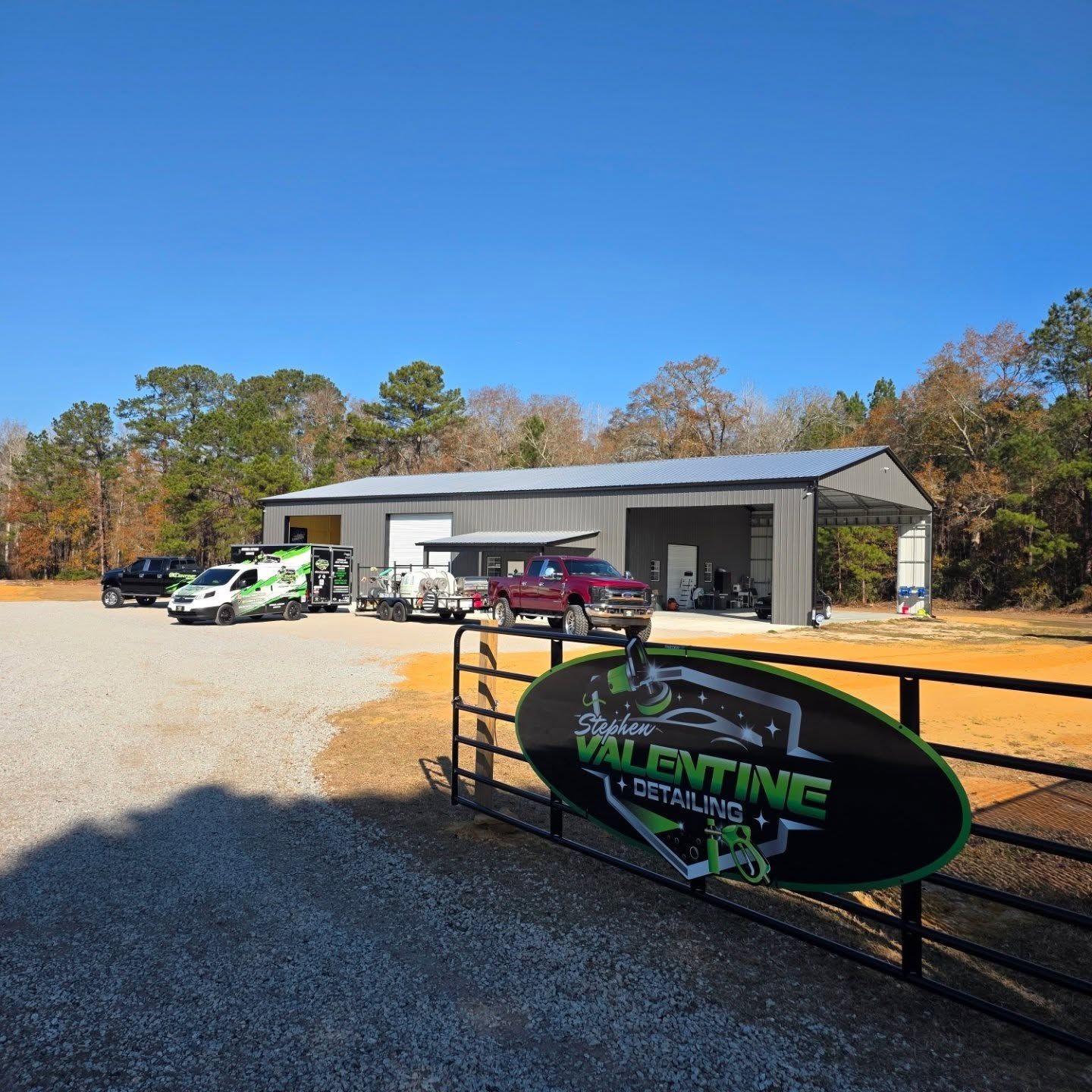Valentine Detailing Shop With a Black Metal Fence and Branded Sign — Valentine Detailing LLC in Walterboro, SC