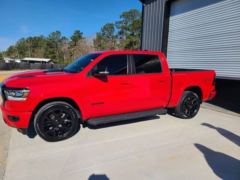 A Bright Red Ram Crew Cab Pickup Truck Parked on a Concrete Lot — Valentine Detailing LLC in Walterboro, SC
