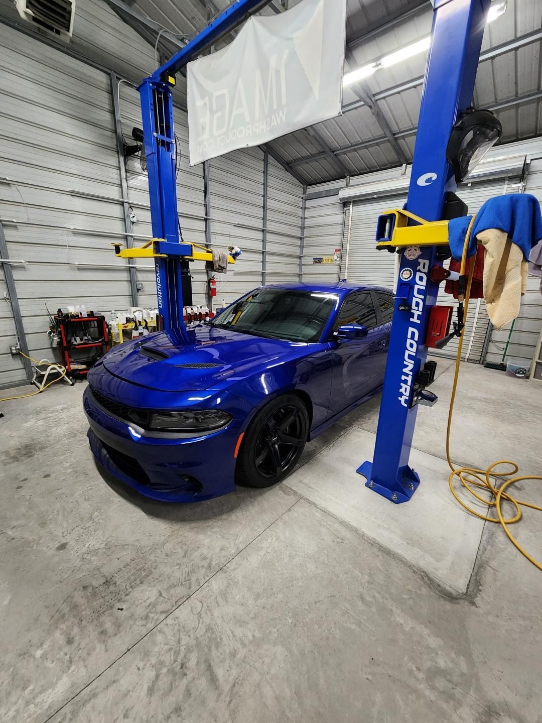 A Blue Dodge Charger Parked Inside a Garage — Valentine Detailing LLC in Walterboro, SC