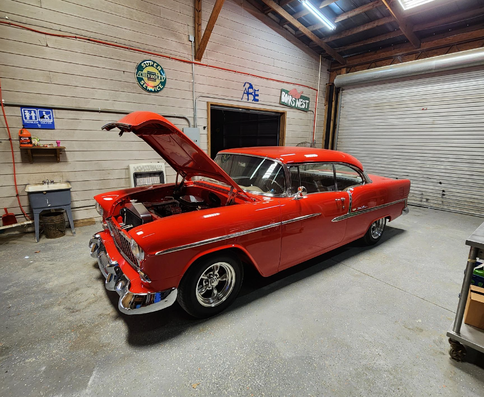 A Bright Red Vintage Car With Its Hood Open, Parked on a Concrete Floor — Valentine Detailing LLC in Walterboro, SC