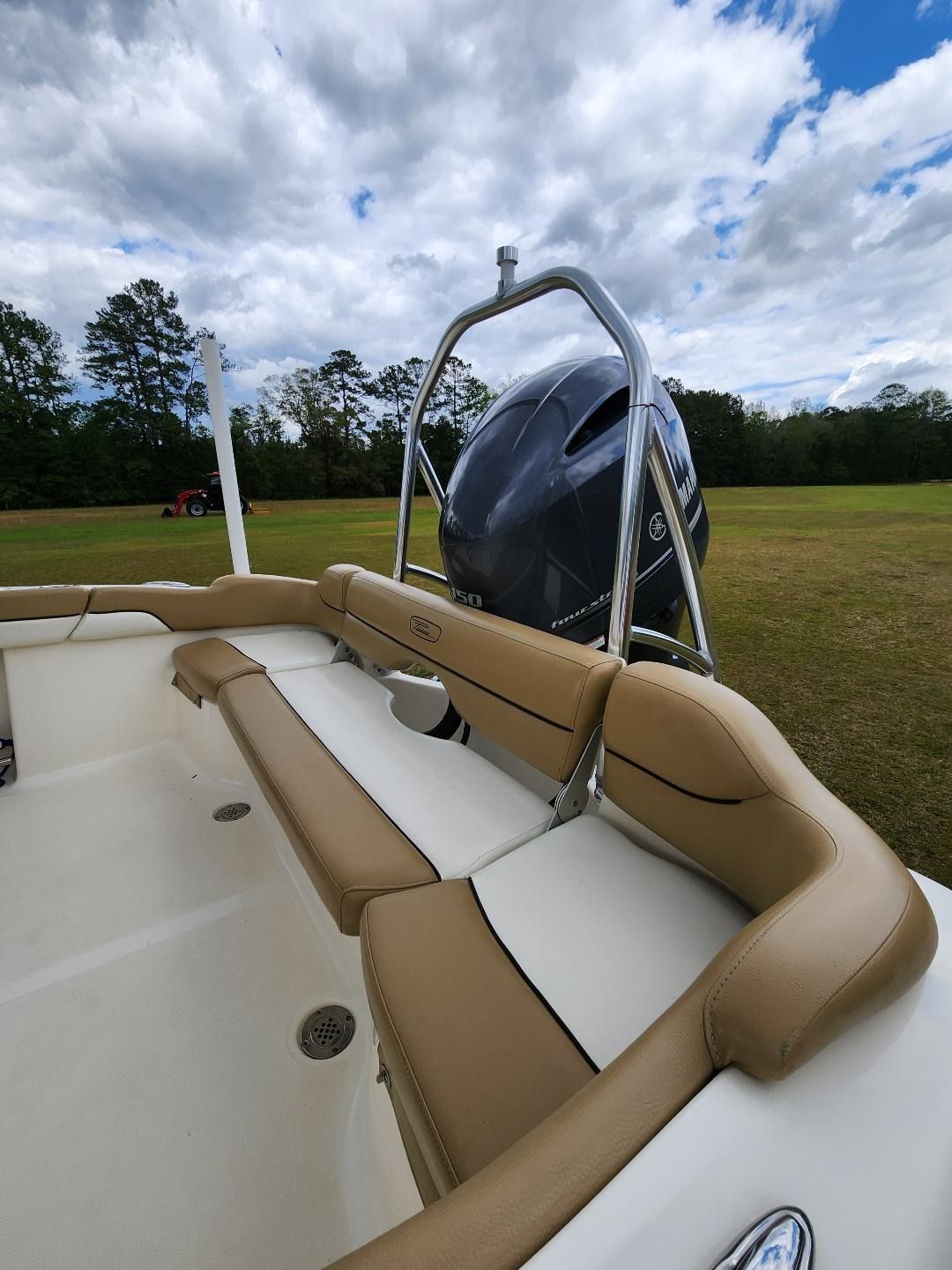 A Boat Interior Featuring Beige and White Cushioned Bench Seating — Valentine Detailing LLC in Walterboro, SC