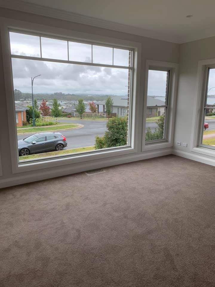 An Empty Room with A Car Parked in Front of A Window — GMT Builders Pty Ltd in Burradoo, NSW