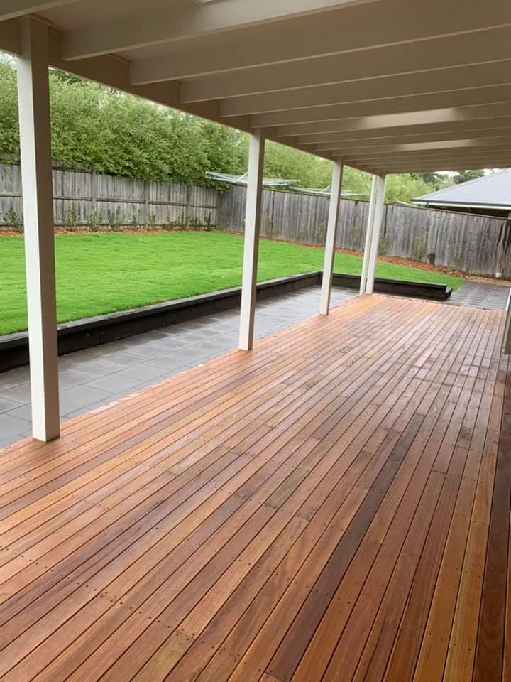 A Large Wooden Deck with A White Roof and A Fence in The Background — GMT Builders Pty Ltd in Kangaloon, NSW