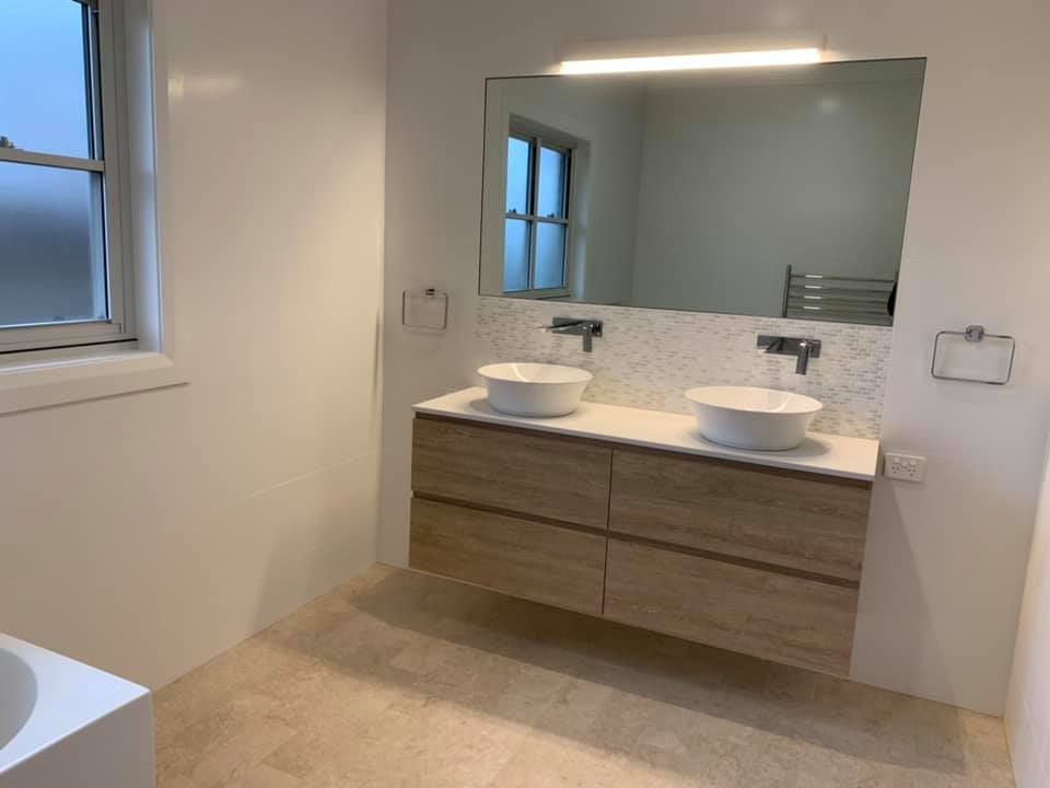A Bathroom with A double Sink , and Mirror — GMT Builders Pty Ltd in Moss Vale, NSW