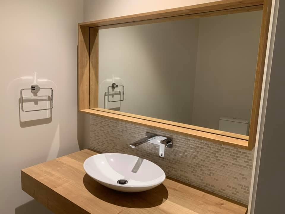 A Bathroom with A Sink and A Large Mirror — GMT Builders Pty Ltd in Bowral, NSW