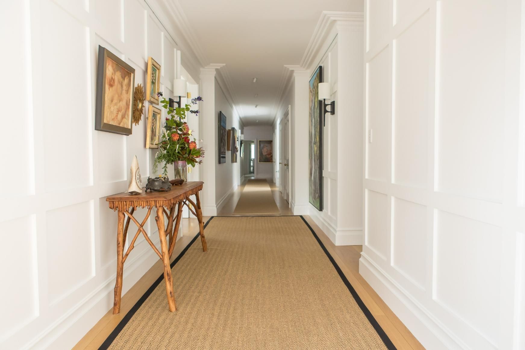 A Long Hallway with A Table in The Middle of It — GMT Builders Pty Ltd in Bundanoon, NSW