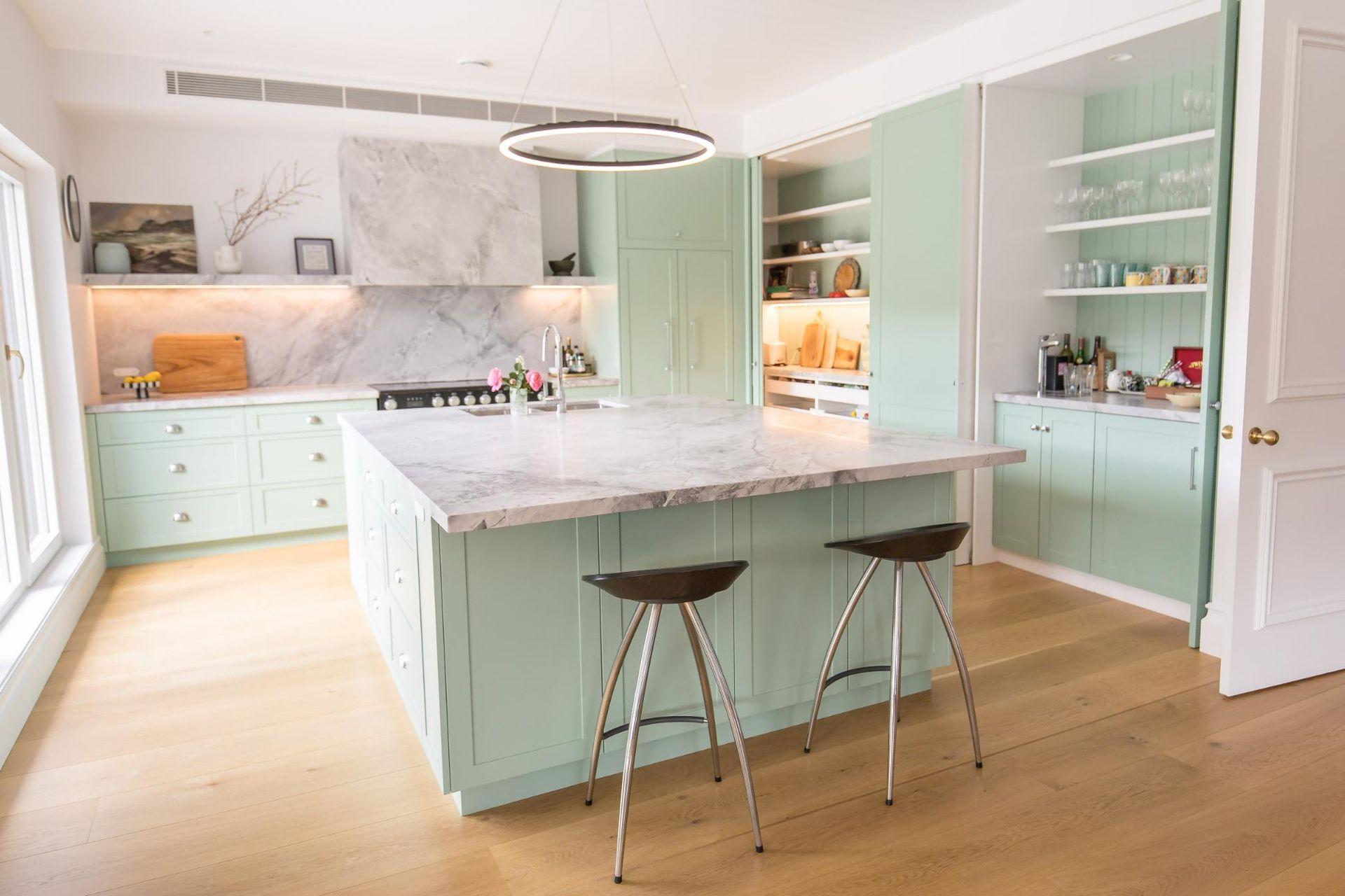 Large Kitchen with Island Bench surrounded by cabinets— GMT Builders Pty Ltd in Burradoo, NSW