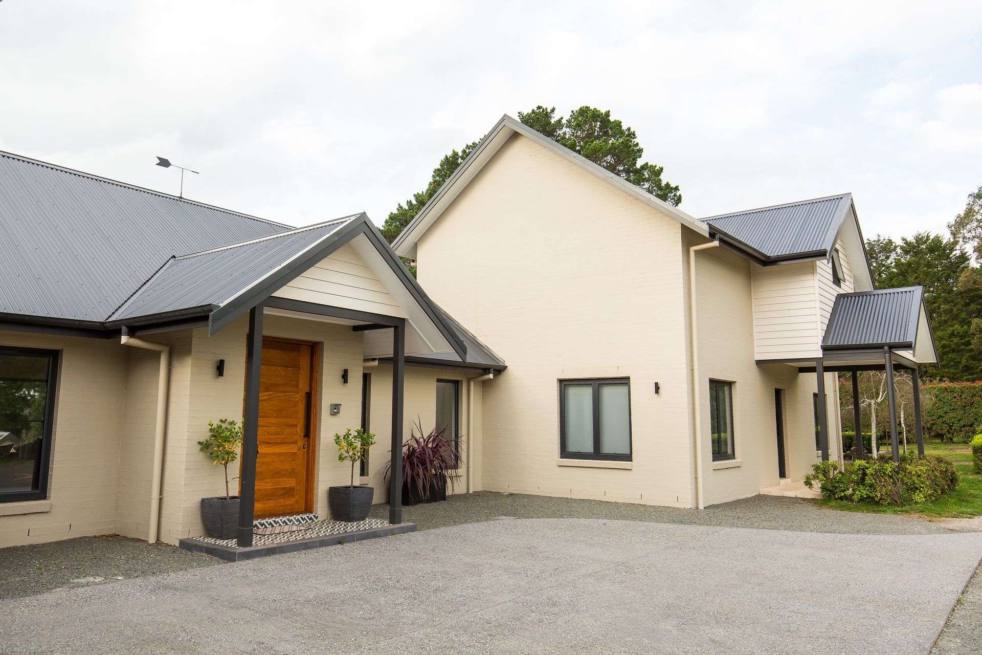 A large house with a driveway in front of it — GMT Builders Pty Ltd in Berrima, NSW