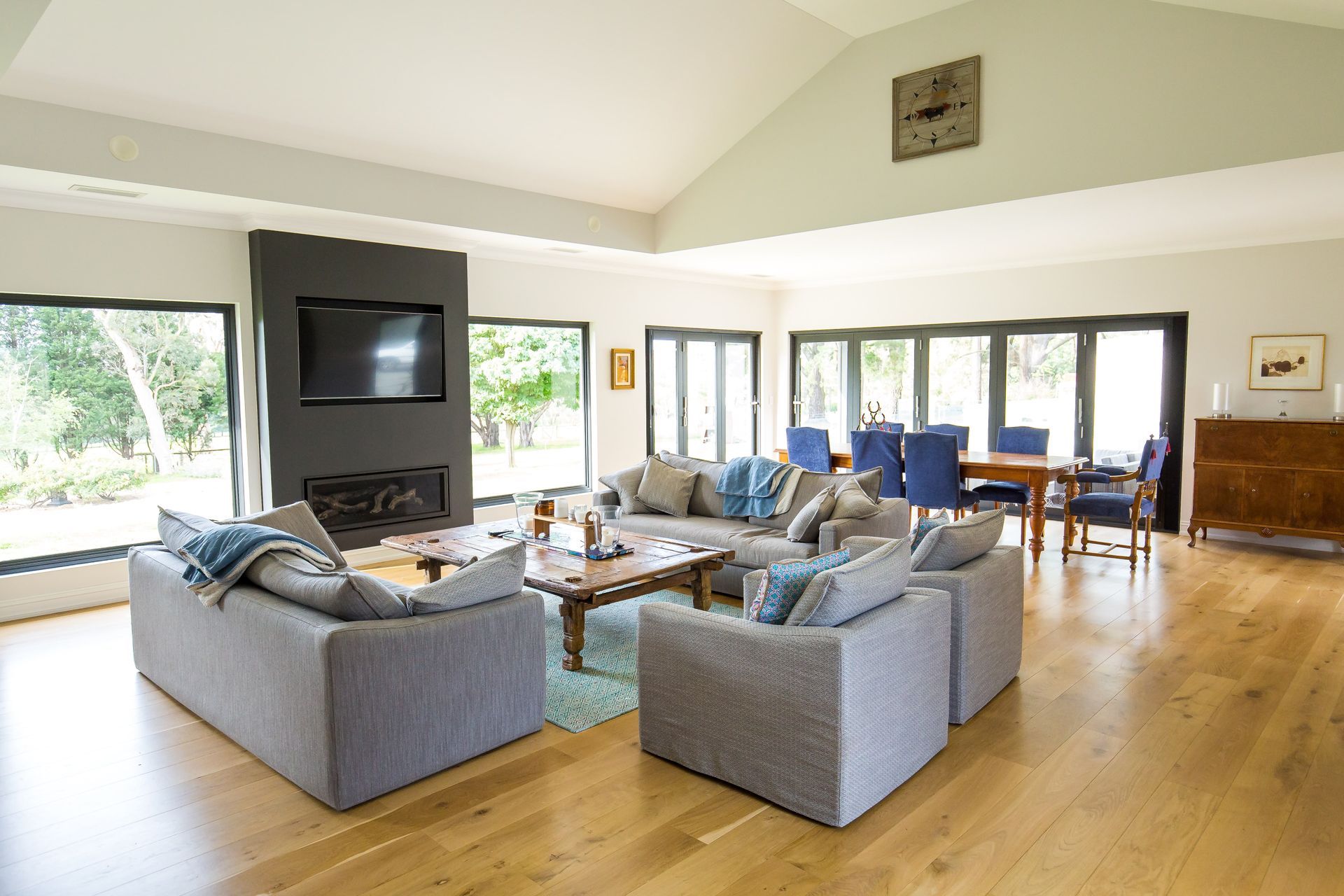 A living room filled with furniture and a television — GMT Builders Pty Ltd in Berrima, NSW