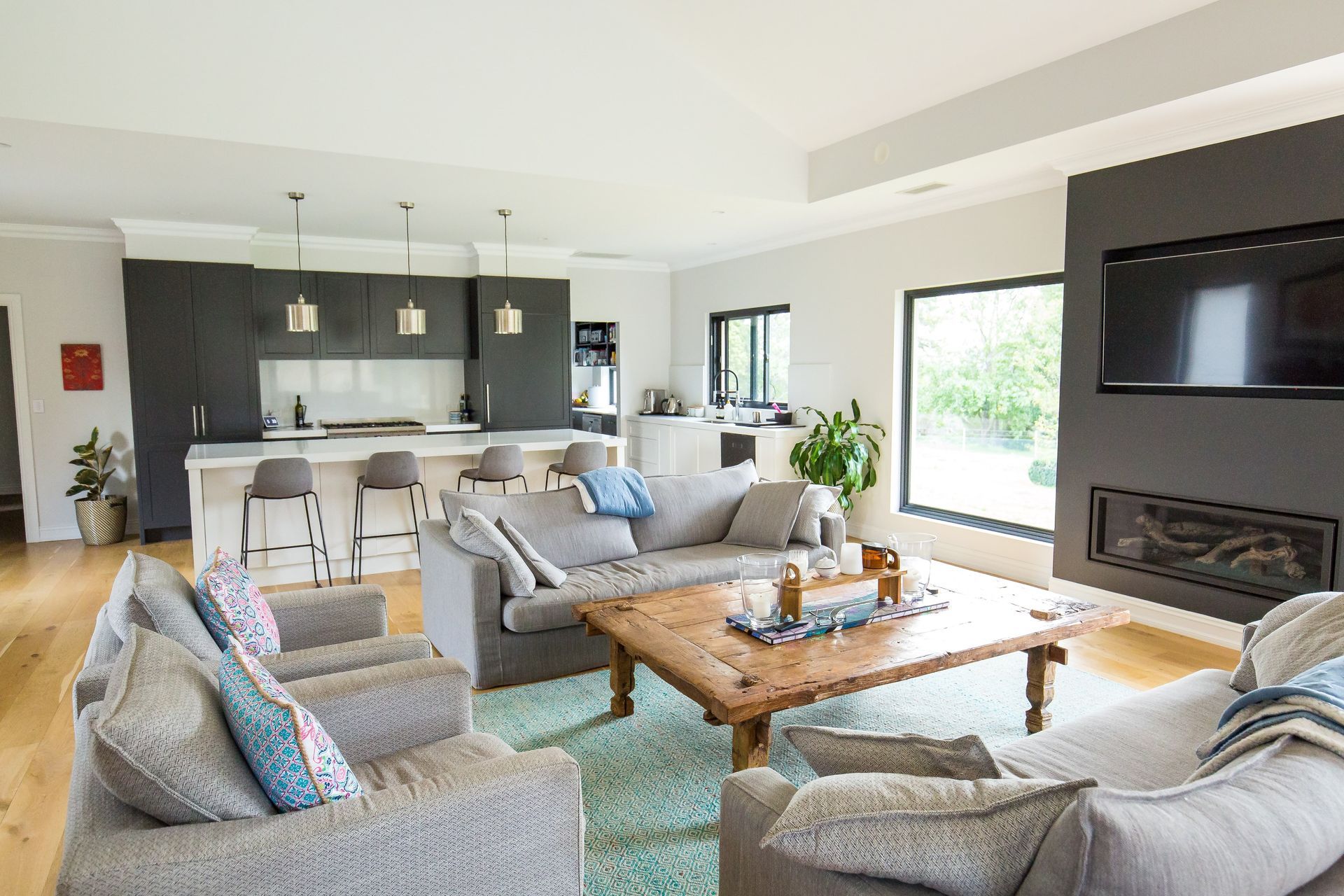 A living room filled with furniture and a flat screen tv — GMT Builders Pty Ltd in Berrima, NSW