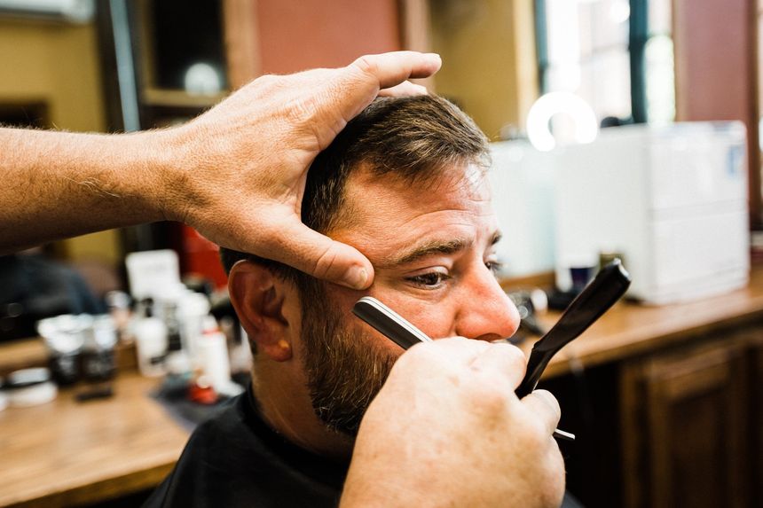 The Star's Barber cleaning up a beard during a beard trim