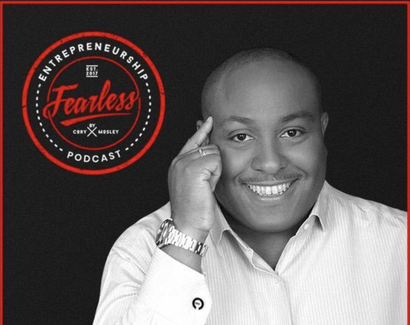 A man is smiling in front of a fearless podcast logo