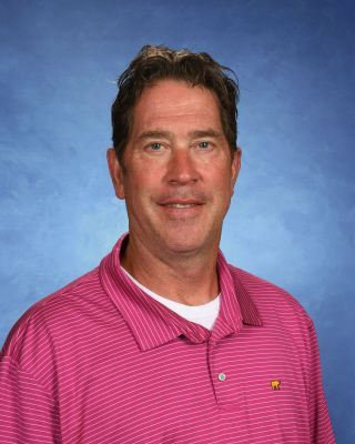 A group of people are standing next to each other in a room.