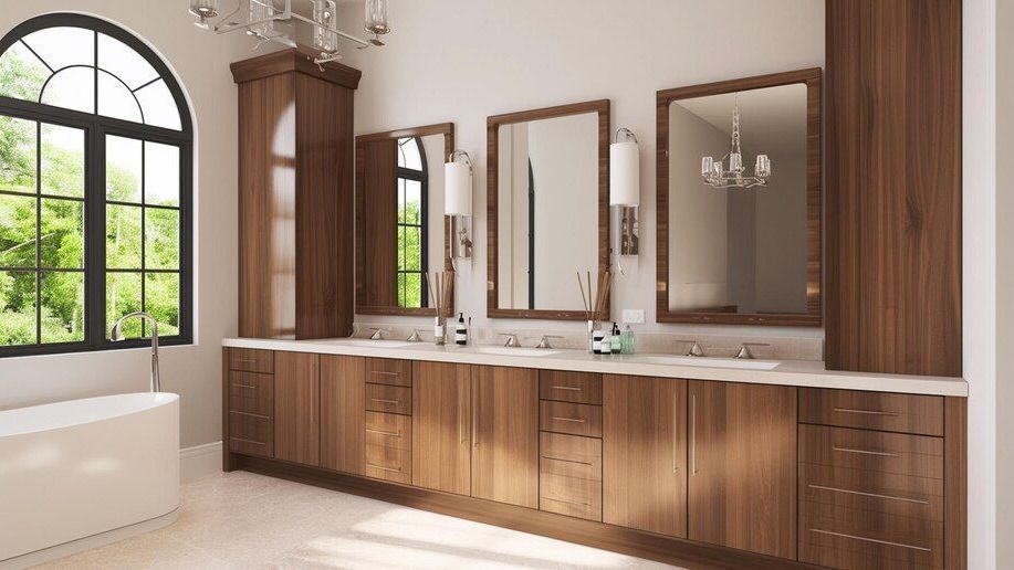 A bathroom with two sinks , two mirrors , a tub and a window.