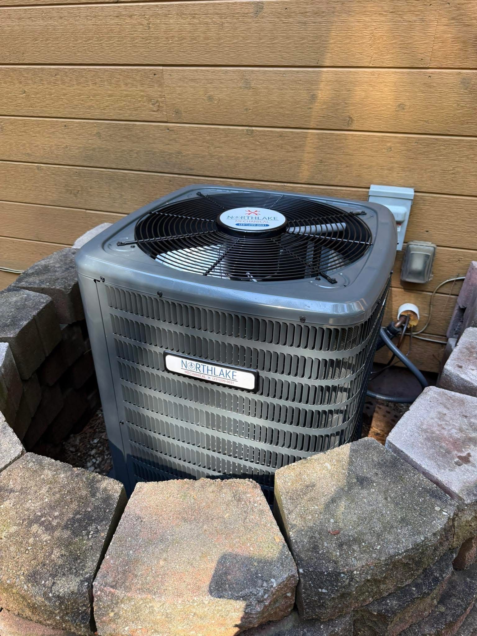A picture of a mountain in a frame on a gray background.