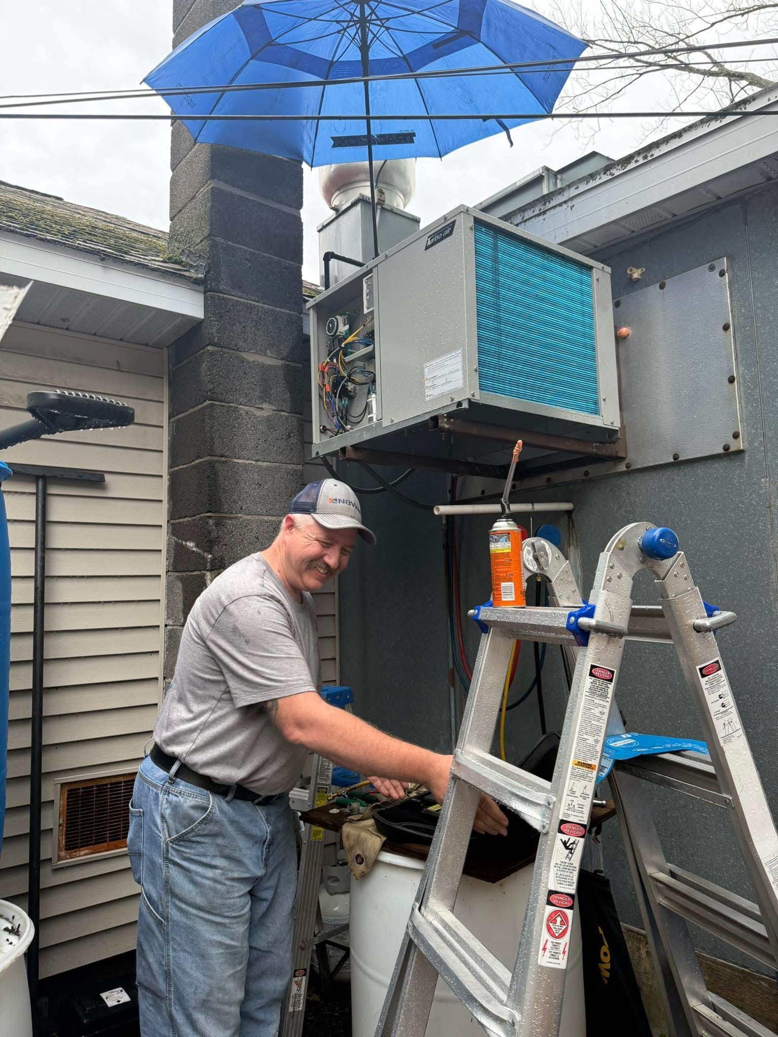 A picture of a mountain in a frame on a gray background.