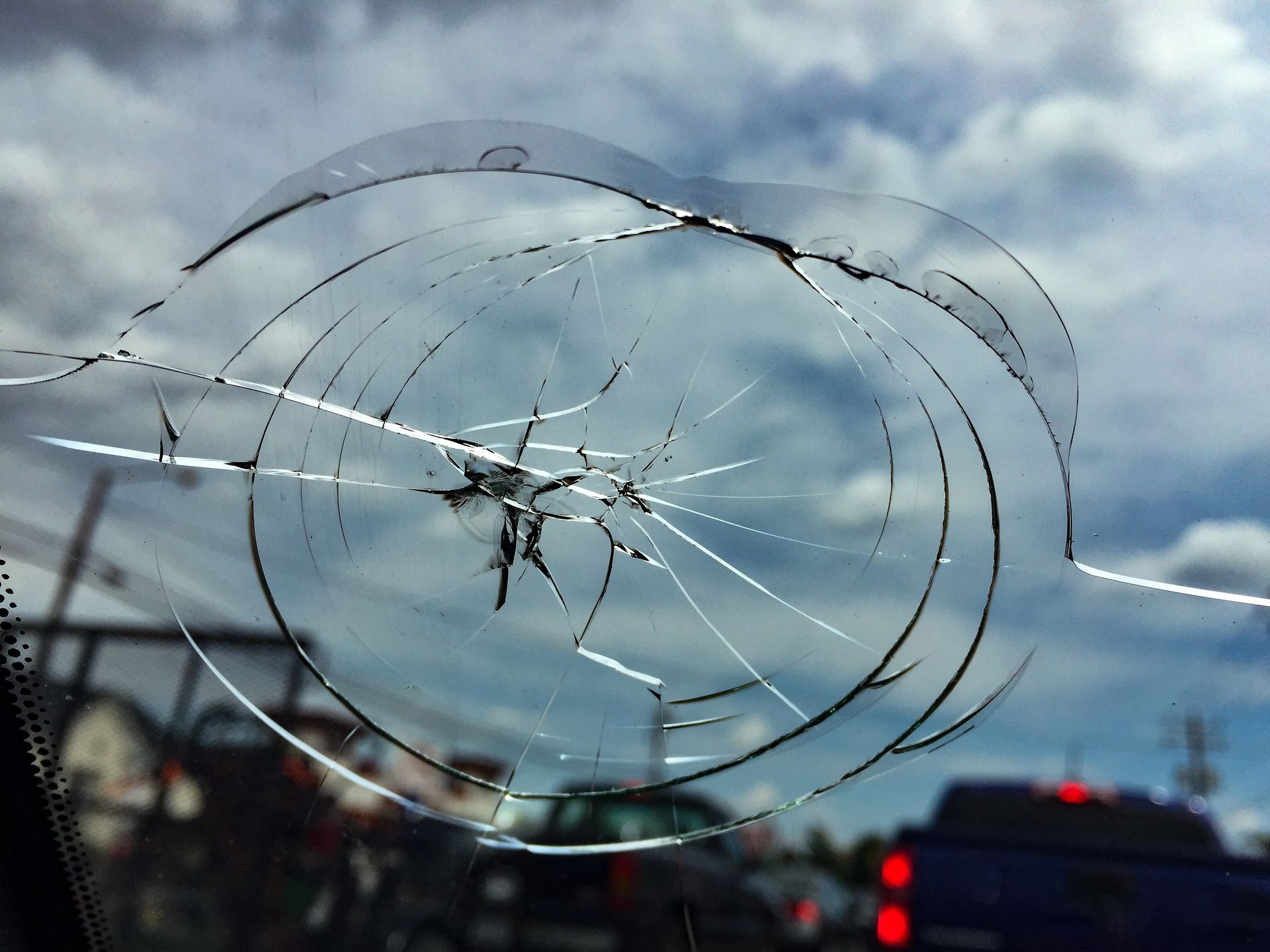 A close-up view of a cracked windshield that requires auto glass repair in Williamstown, NJ.