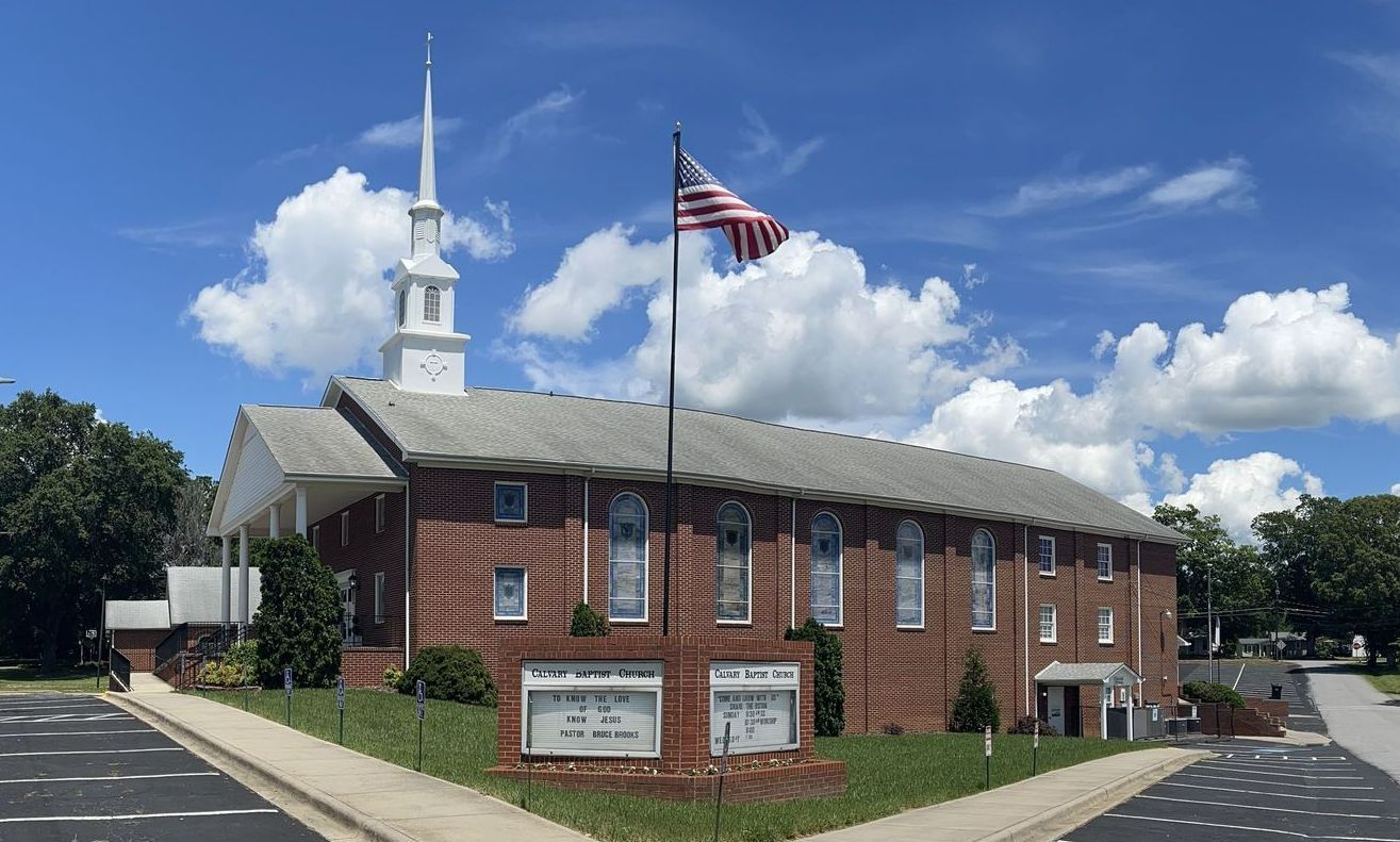 Picture of Calvary Baptist Church in Lincolnton, North Carolina. American Flag Flying High. The weather is very Nice.