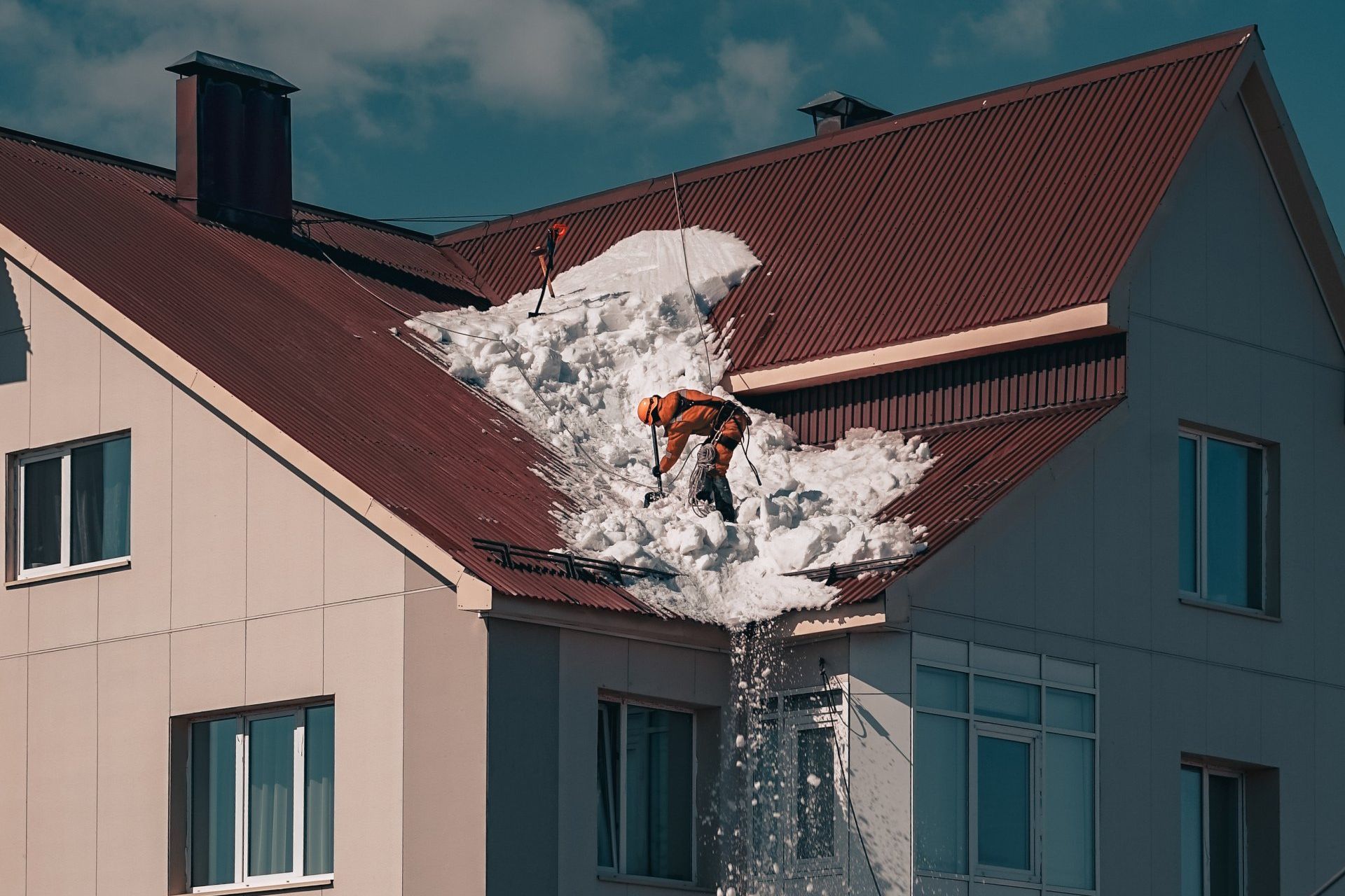 image of a person cleaning the roof