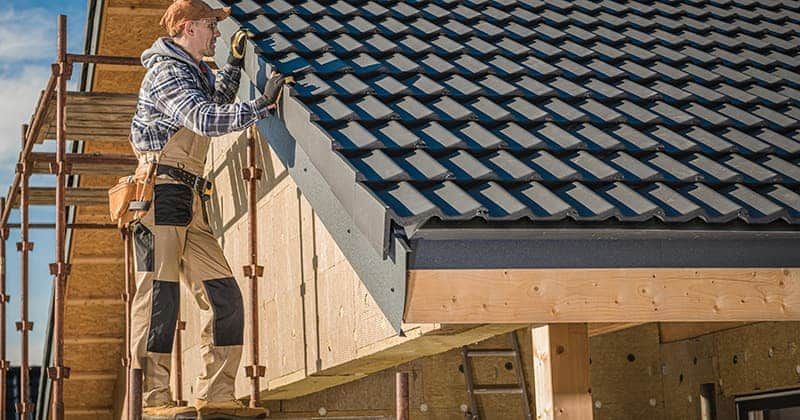 image of roofer inspect