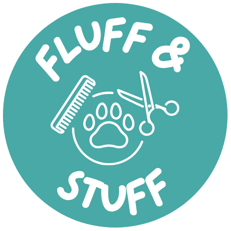 A blue circle with a comb , scissors , and a paw print on it.