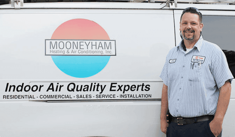 Man standing beside van