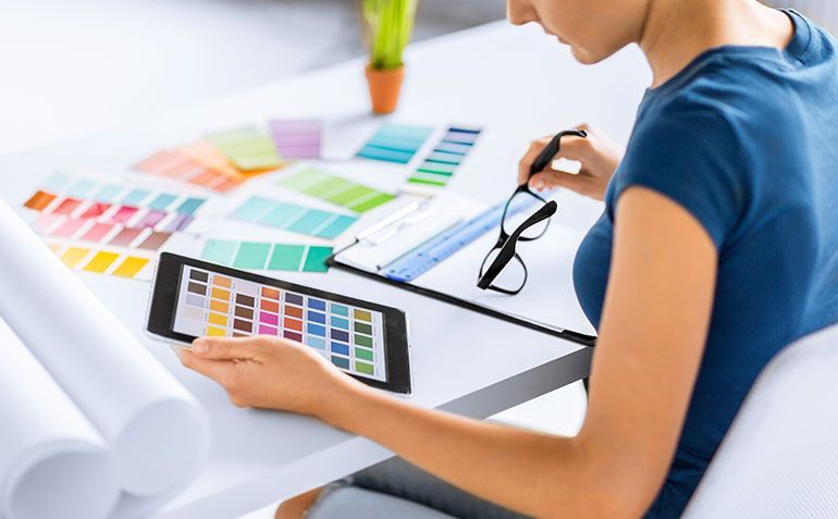 Business cards with head coach portraits and the logo for Armored Sports.