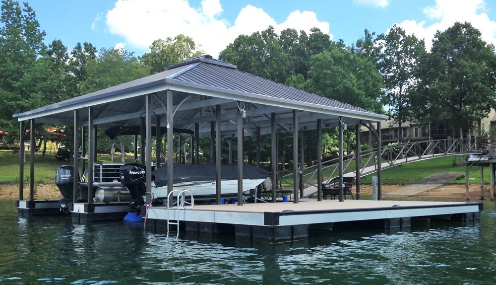 Double slip hip roof boat dock with burnished slate roof and posts matched with buckskin decking - Dock Solutions of Kentucky | Lexington, KY