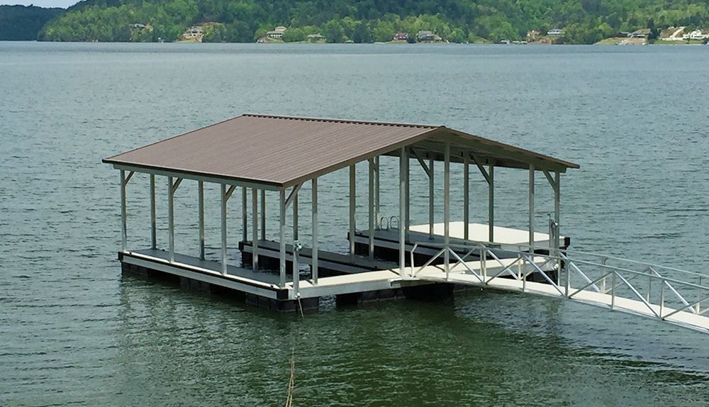 Double slip gable roof boat dock with burnished slate roof, mill finished posts, and silverstone LockDry aluminum decking - Dock Solutions of Kentucky | Lexington, KY