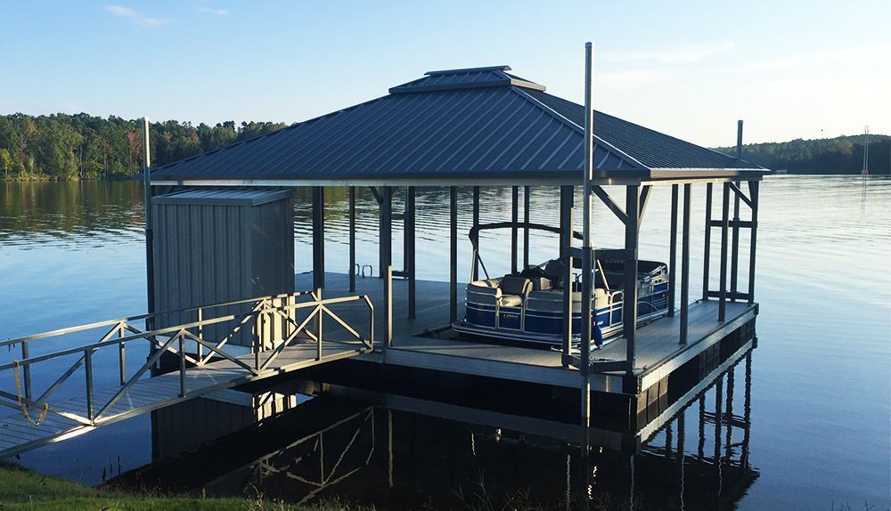 Single slip hip roof boat dock. Granite gray posts and decking with gray roof - Dock Solutions of Kentucky | Lexington, KY