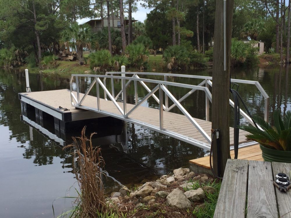 A dock with a bridge with white railings - Dock Solutions of Kentucky | Lexington, KY